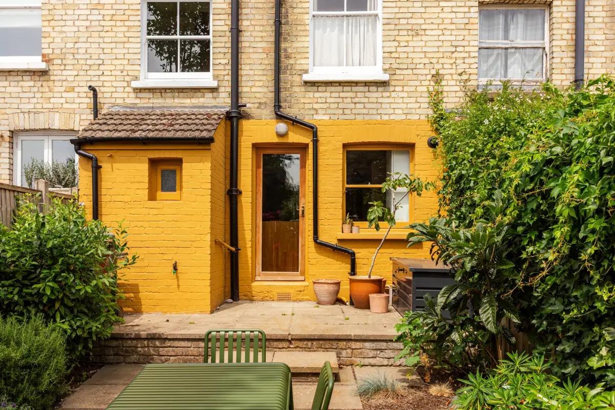 A Muted Color Palette and Original Details in a Victorian Terrace House 24 yellow painted brickwork