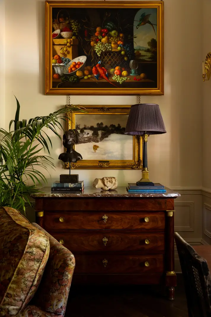 A Mixture of Patterns, Colors, and Materials in a Stunning London Apartment 5 antique cabinet living room detail