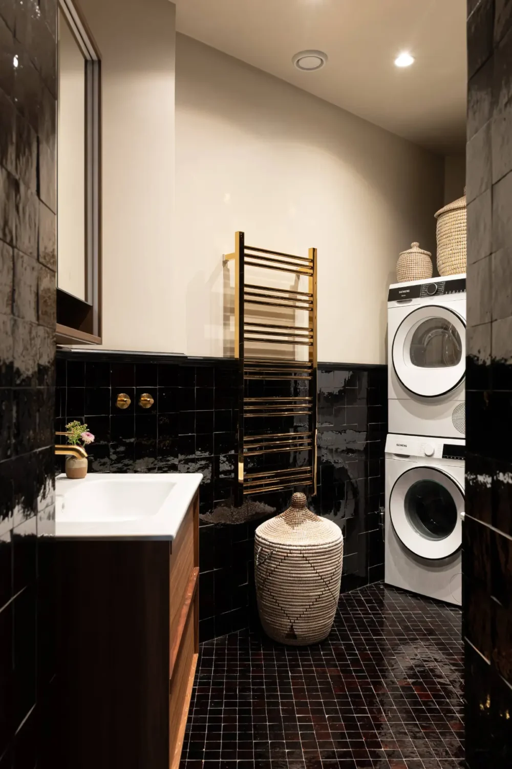 A Luxurious Family Apartment with a Dramatic Black Bathroom 29 bathroom black tiles brass fittings