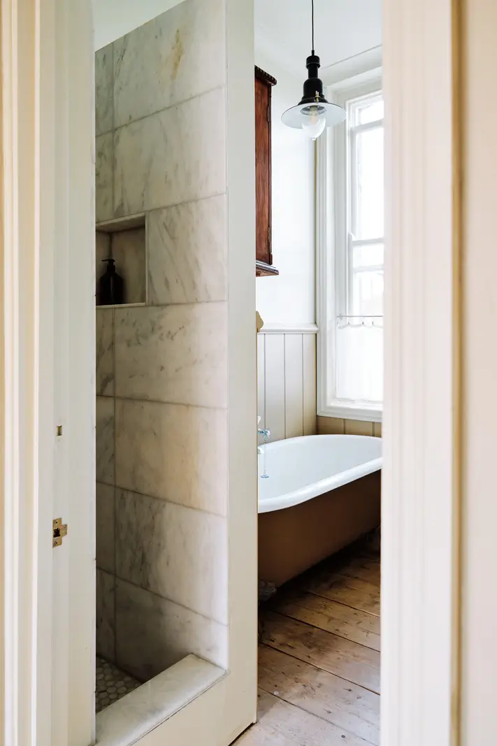 Restored Features in a Charming Georgian Apartment in London 14 bathroom timber floor shower freestanding bath