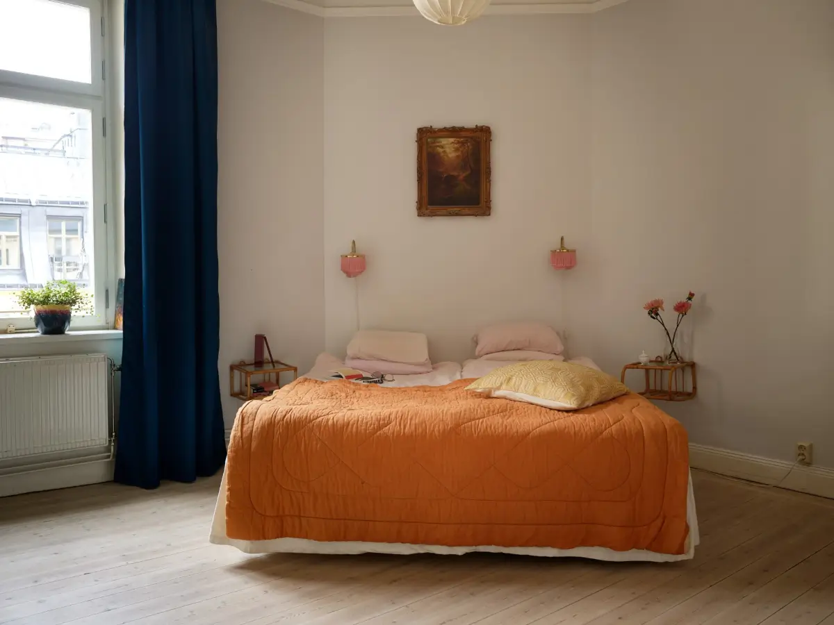 A Spacious Family Apartment with Original Details in Stockholm 22 bedroom orange bedspread