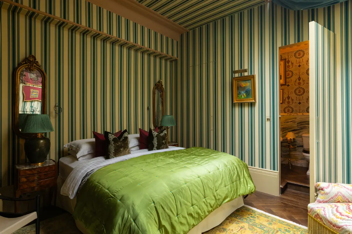 A Mixture of Patterns, Colors, and Materials in a Stunning London Apartment 17 bedroom striped wallpaper