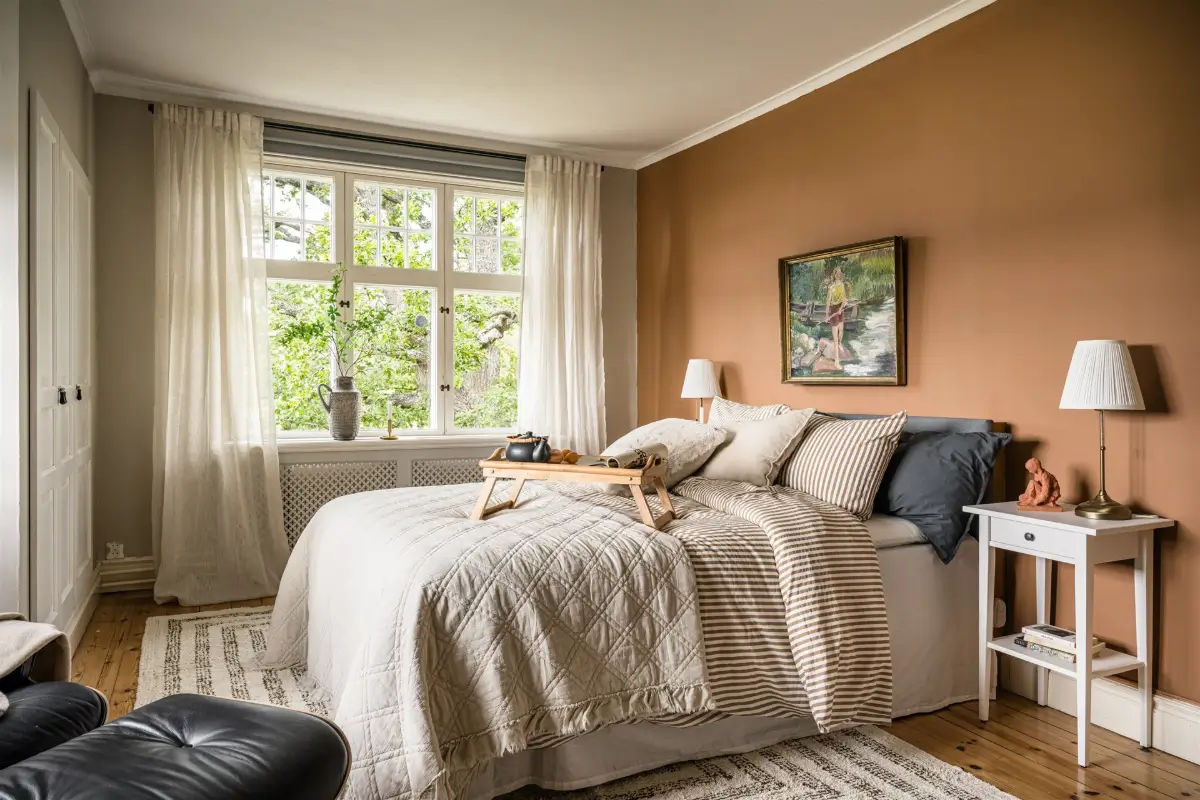 A Cozy Early 20th-Century Home with Views of Lake Mälaren in Sweden 19 bedroom terracotta wall color