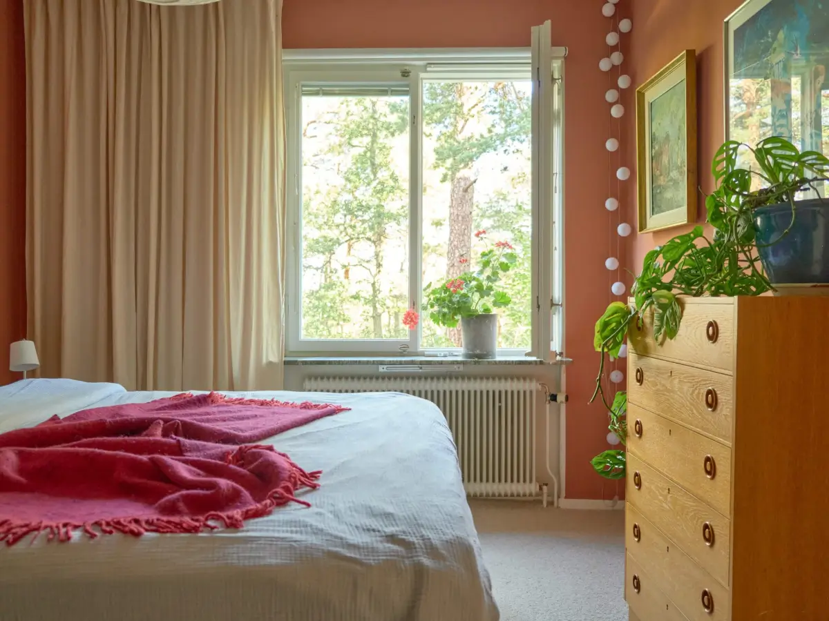 A Colorful and Cozy Midcentury Apartment in Stockholm 15 bedroom terracotta walls carpet