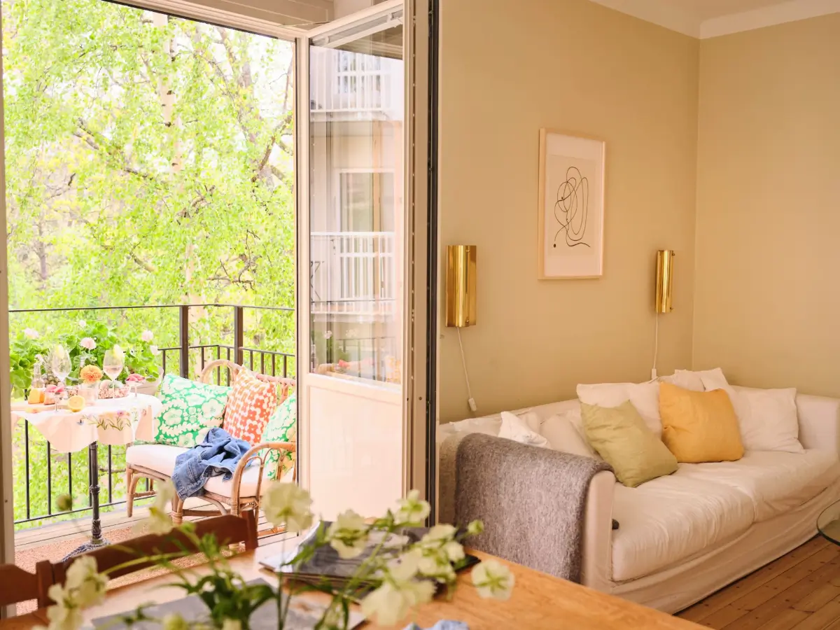 Soft Beige Interiors with the Occasional Bright Color Pop in Stockholm 5 beige living room balcony doors