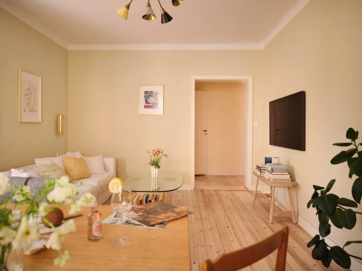 Soft Beige Interiors with the Occasional Bright Color Pop in Stockholm 4 beige living room wooden floor