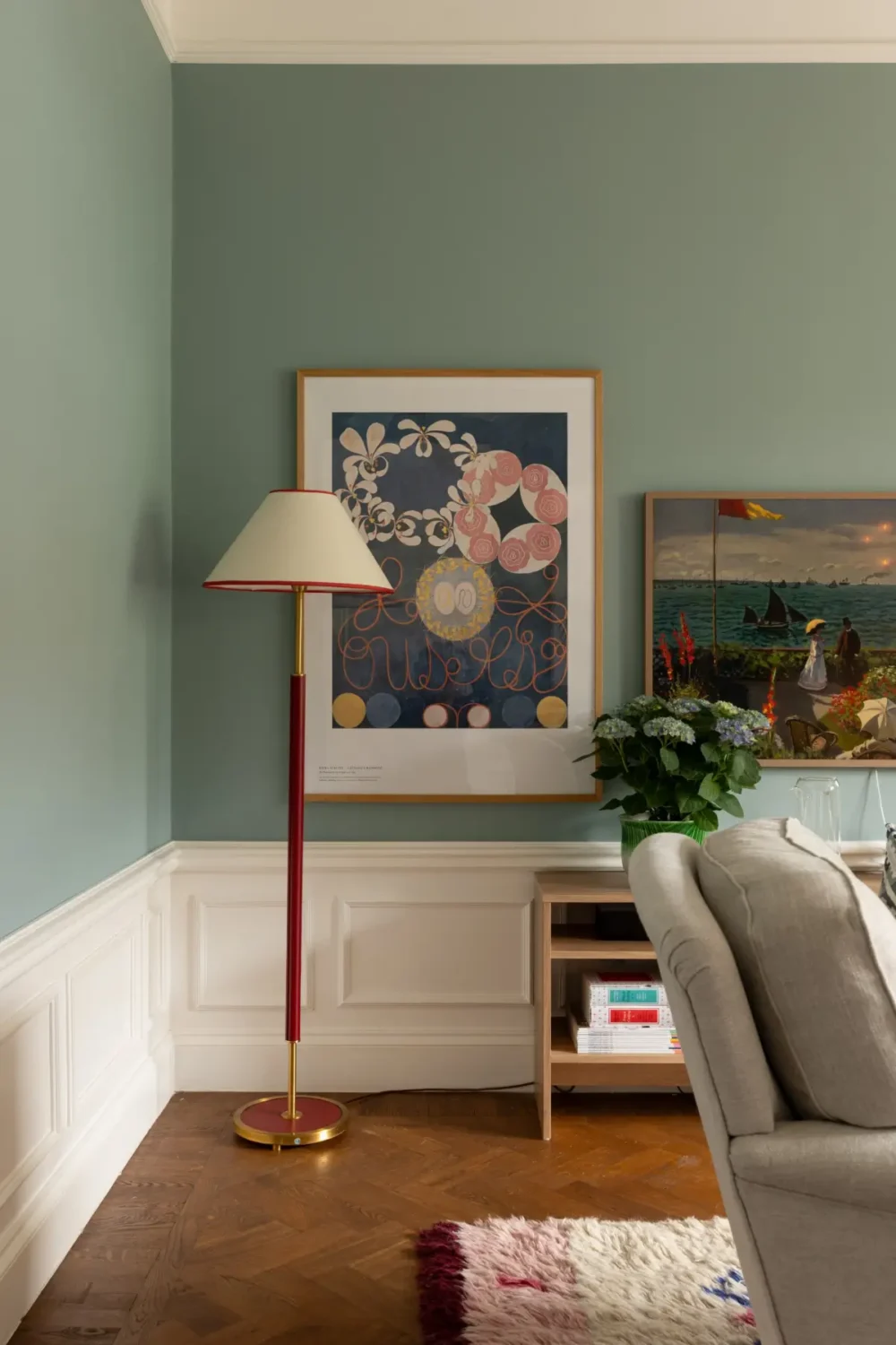 A Warm Color Palette in a Cozy 1920s Apartment in Stockholm 15 blue living room high baseboards
