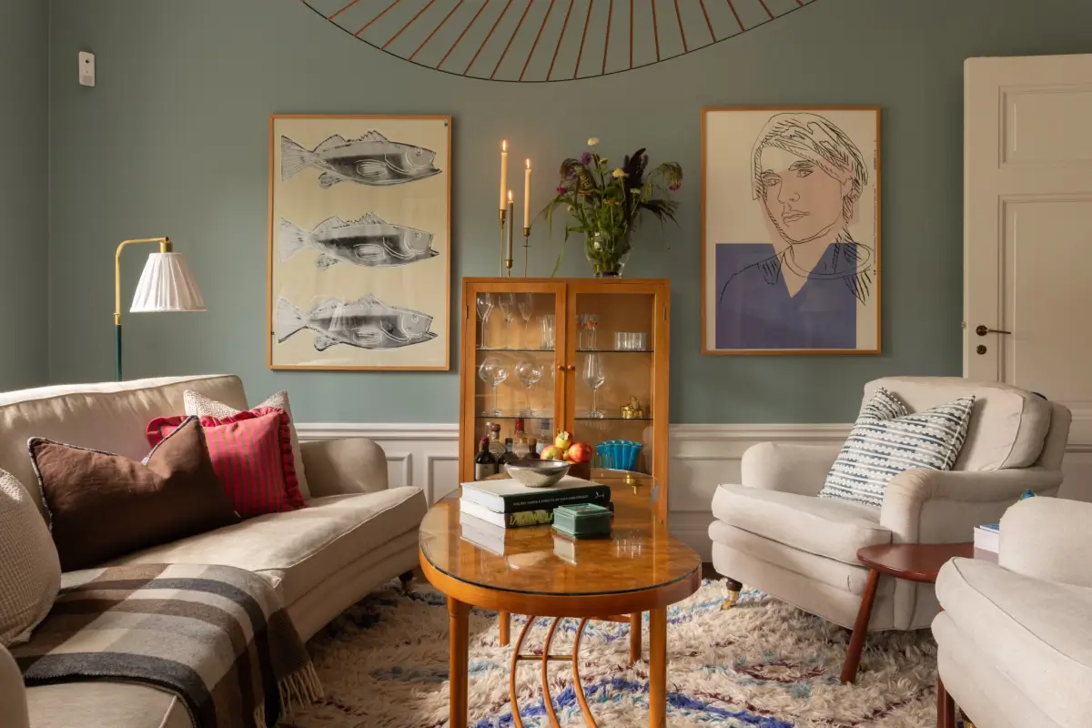 A Warm Color Palette in a Cozy 1920s Apartment in Stockholm 14 blue living room