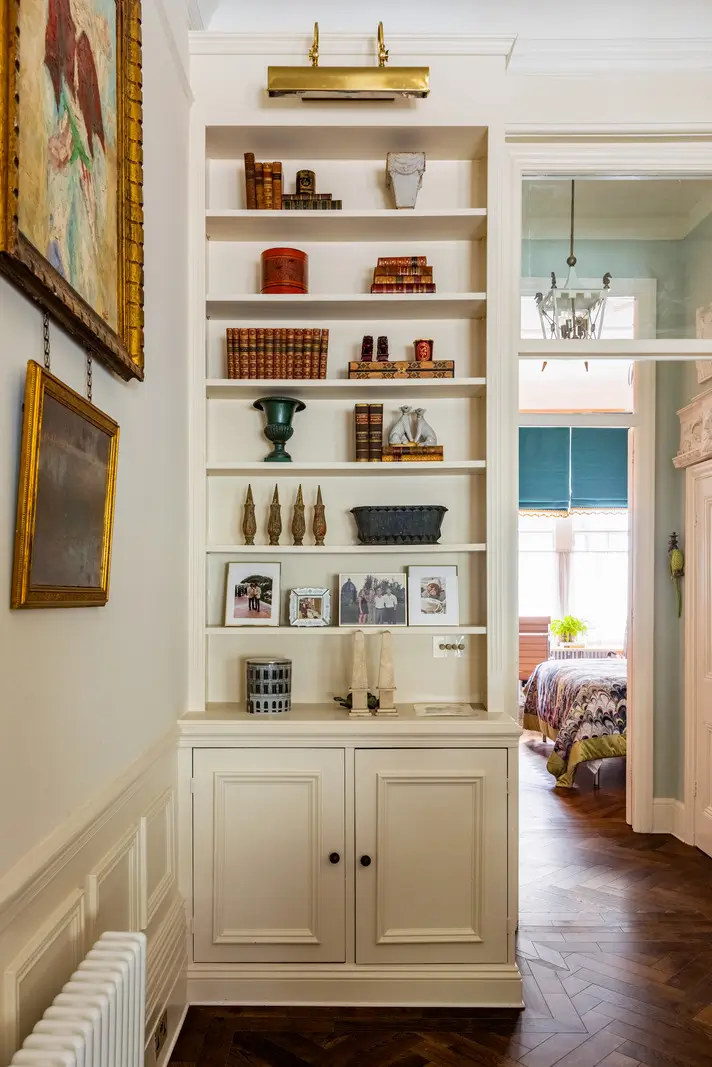 A Mixture of Patterns, Colors, and Materials in a Stunning London Apartment 6 built-in shelves
