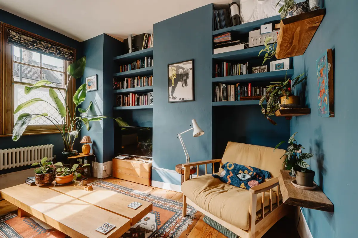 Shades of Blue and Original Details in a Victorian Garden Apartment 4 dark blue living room built-in shelves