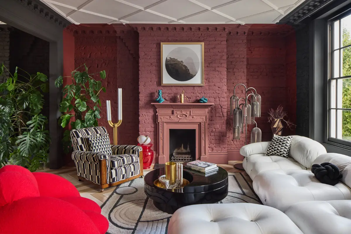 dark pink sitting room fireplace white sofa