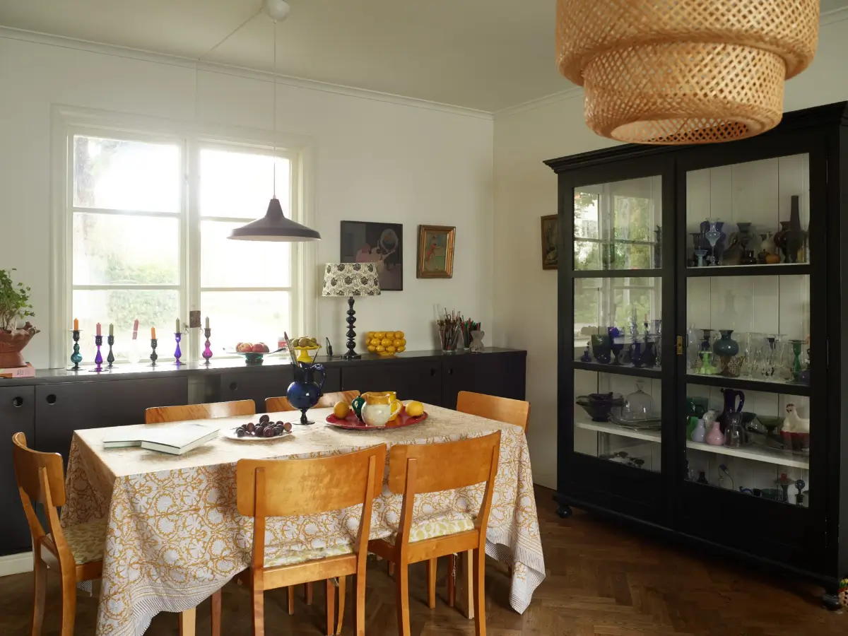 A Well-Preserved 1920s House with a Green Kitchen in Stockholm 10 dining area glass cabinet