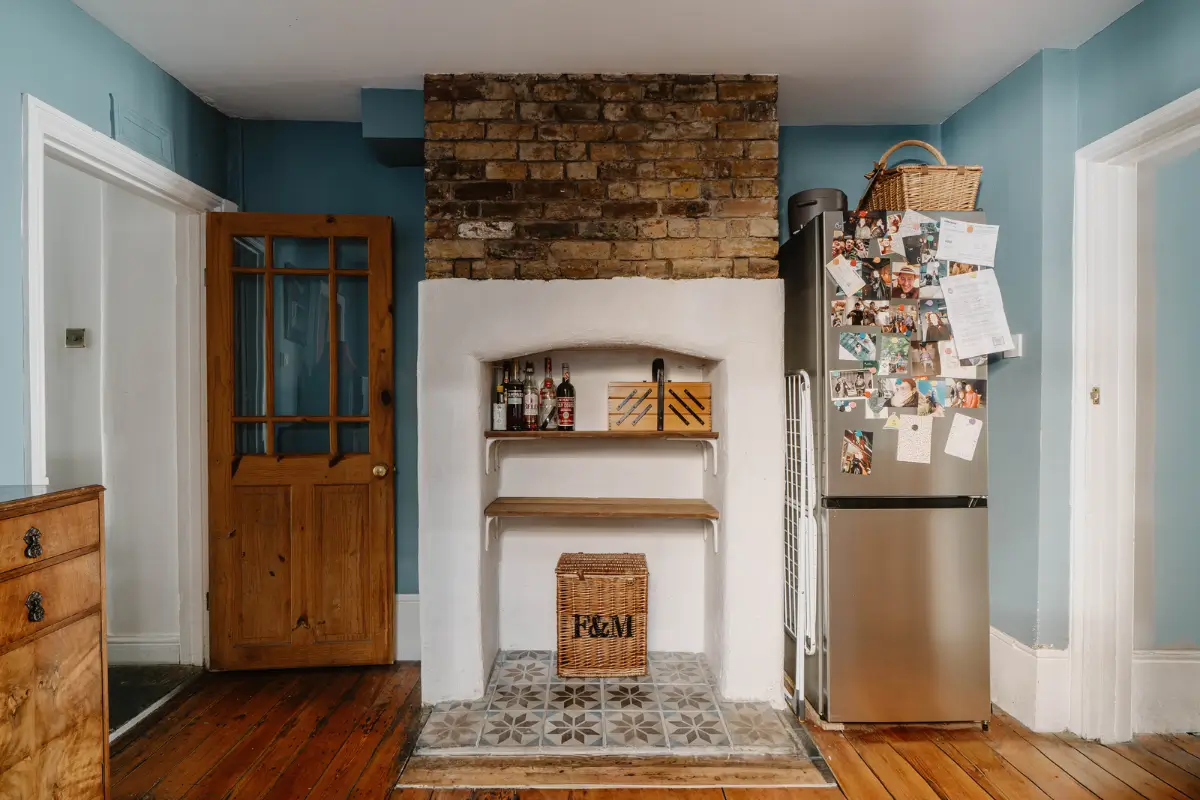 Shades of Blue and Original Details in a Victorian Garden Apartment 8 fireplace mantel