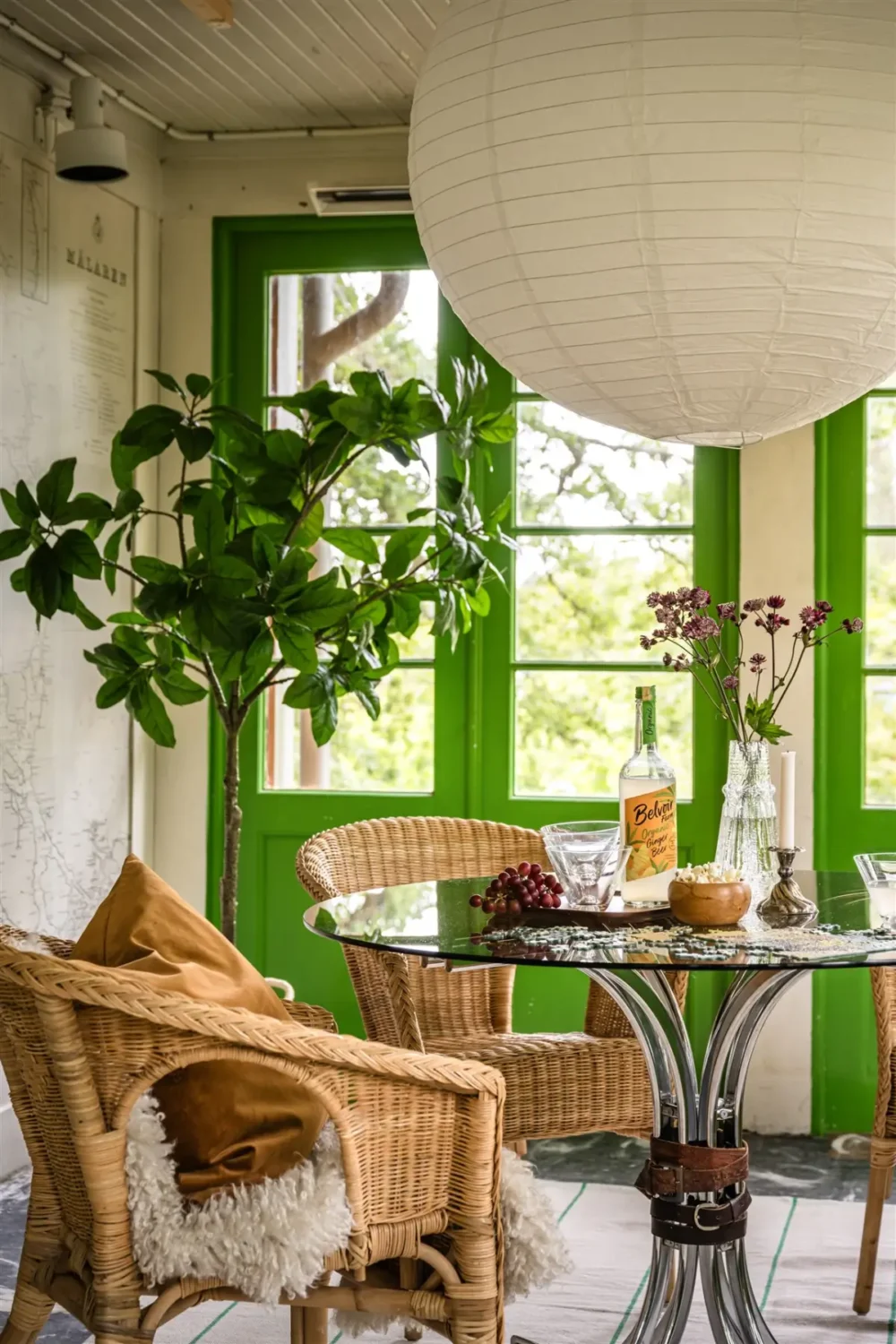 A Cozy Early 20th-Century Home with Views of Lake Mälaren in Sweden 33 garden room green doors