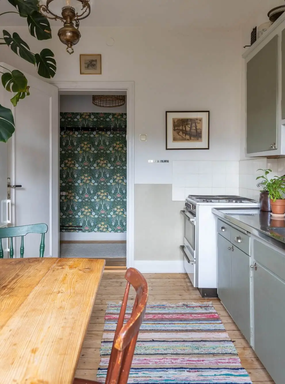 Warm Tones, Antiques, and Period Features in a Swedish Studio Apartment 17 gray midcentury kitchen wooden table