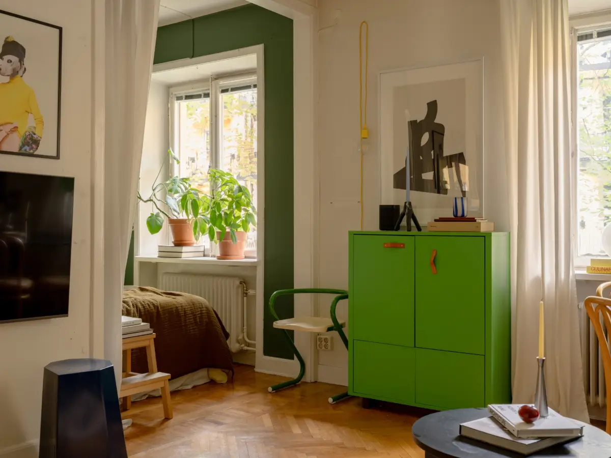 A 1920s Studio Apartment with a Forest Green Sleeping Alcove 9 green cabinet
