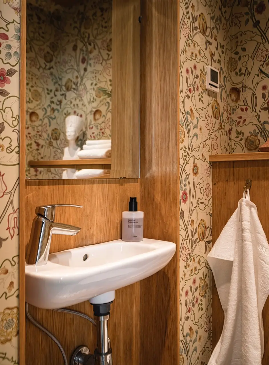 A Cozy Early 20th-Century Home with Views of Lake Mälaren in Sweden 28 guest toilet small sink