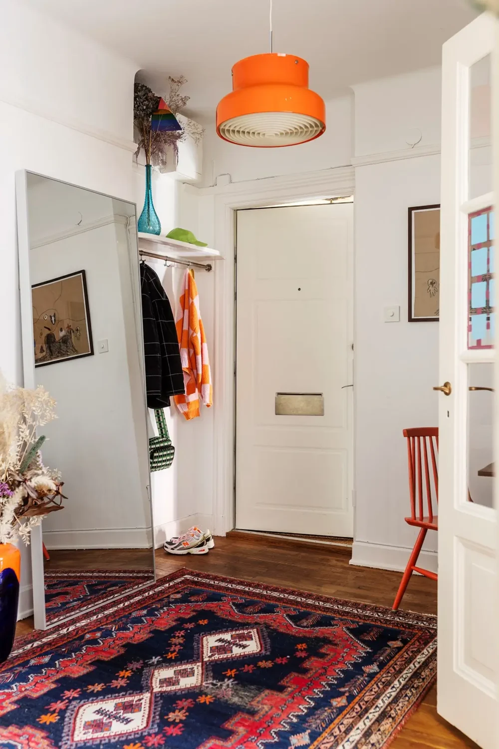 A Charming Swedish Courtyard Apartment Filled with Art 24 hall vintage rug A Charming Swedish Courtyard Apartment Filled with Art