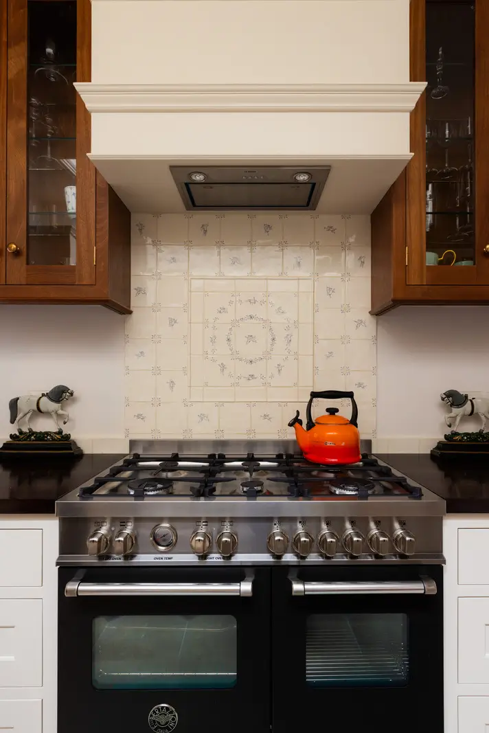 A Mixture of Patterns, Colors, and Materials in a Stunning London Apartment 10 handpainted backsplash tiles