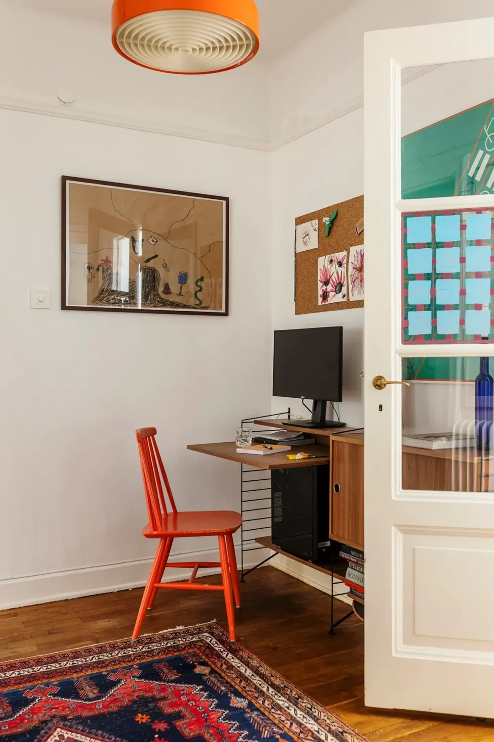 A Charming Swedish Courtyard Apartment Filled with Art 21 home office red chair