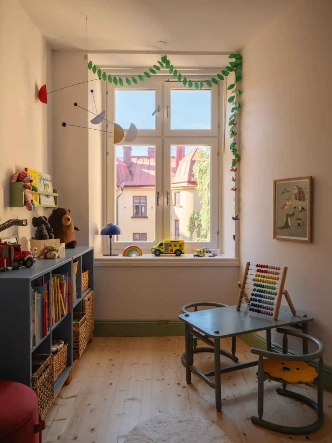 A Bright Apartment Where Historic Character Meets Contemporary Design 27 kids bedroom blue cabinets