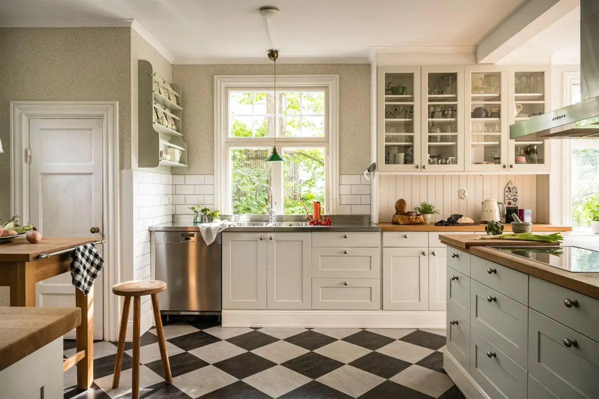 A Cozy Early 20th-Century Home with Views of Lake Mälaren in Sweden 4 kitchen checkerboard floor wallpaper paneling