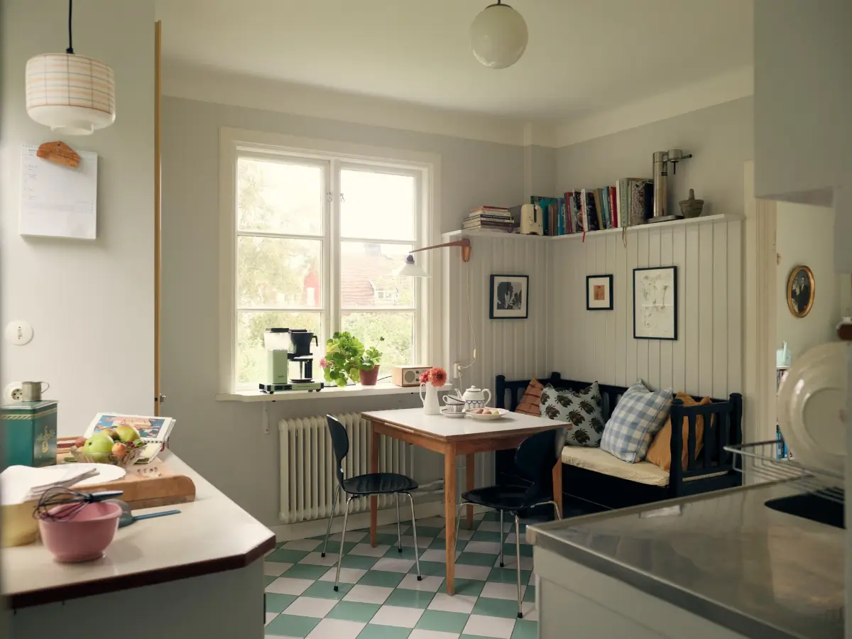 A Cheerful Color Palette in an Early 20th Century Villa in Stockholm 15 kitchen checkered floor breakfast table tongue and groove paneling