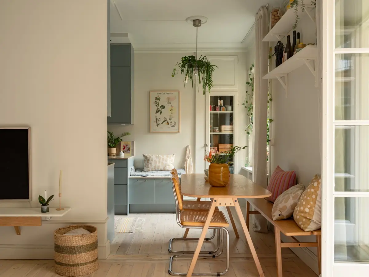 A Light Color Palette and a Charming Private Patio in a Stockholm Apartment 11 kitchen dining space