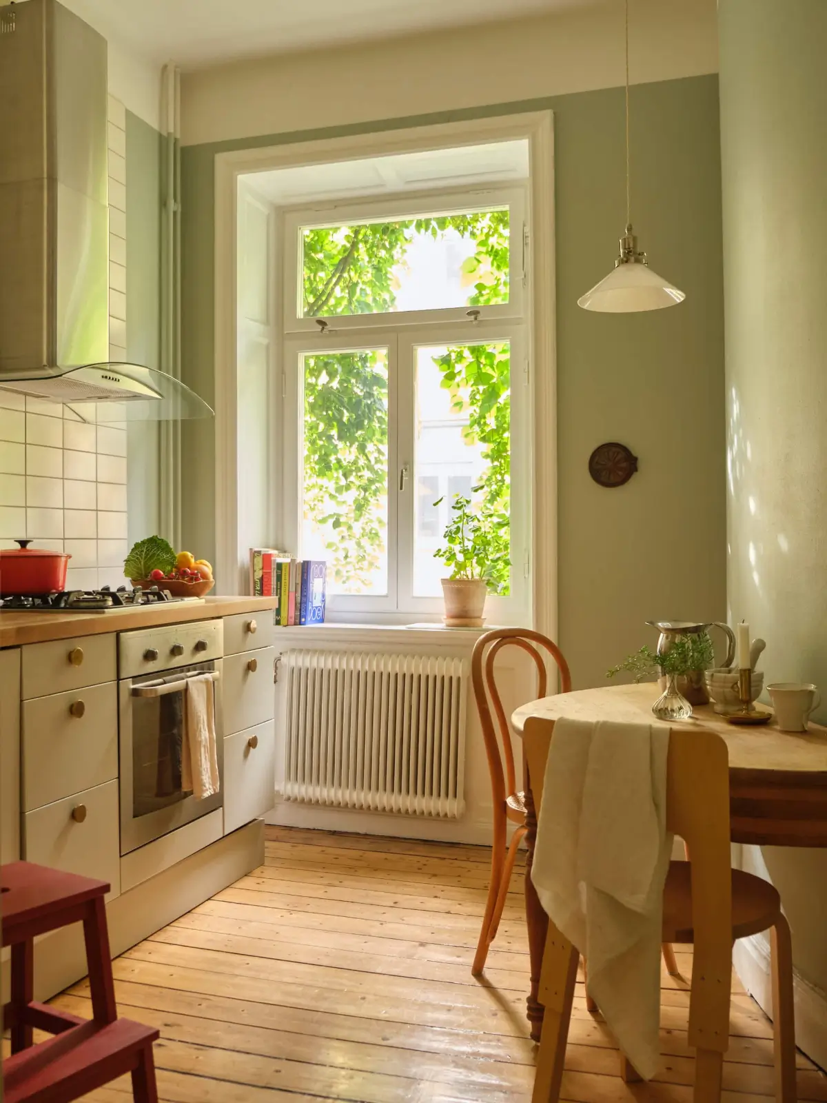 kitchen green walls small wooden table nordroom