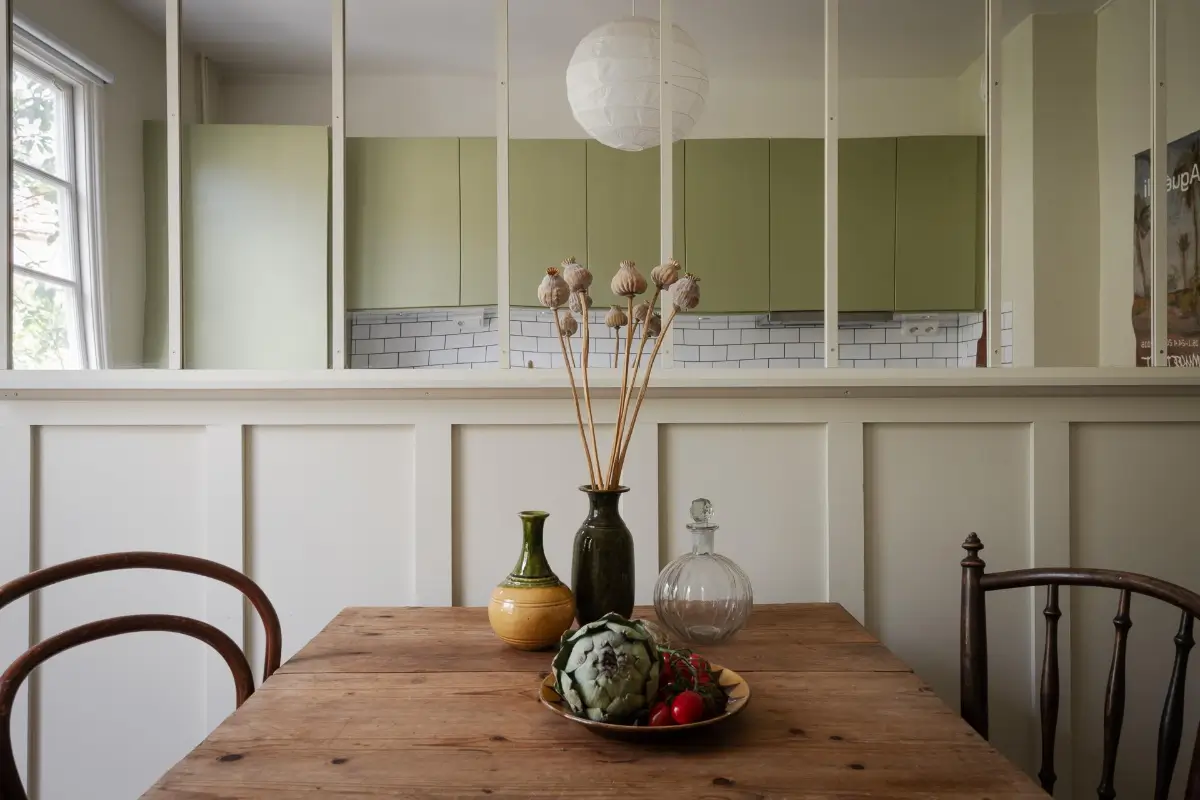 Historic Character and Color in a Swedish Studio Apartment 17 kitchen mirror wall