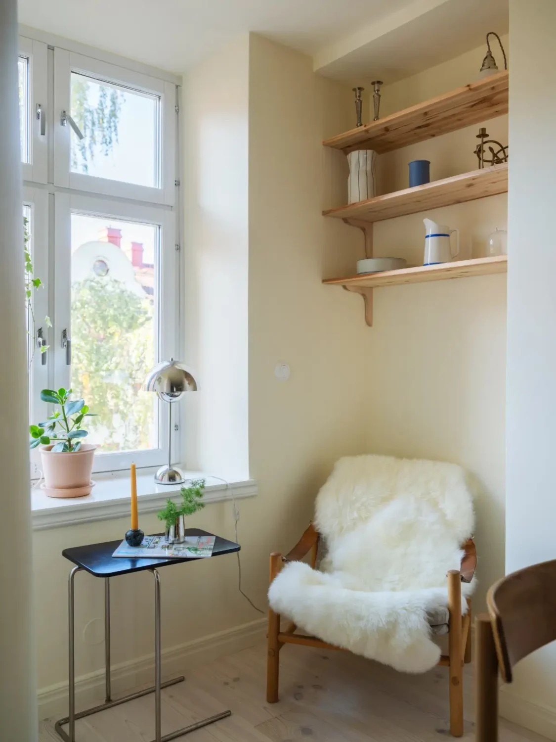 A Bright Apartment Where Historic Character Meets Contemporary Design 23 kitchen reading nook wooden shelves
