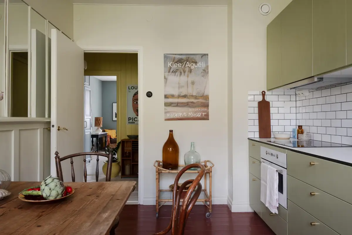 Historic Character and Color in a Swedish Studio Apartment 21 kitchen red painted floor