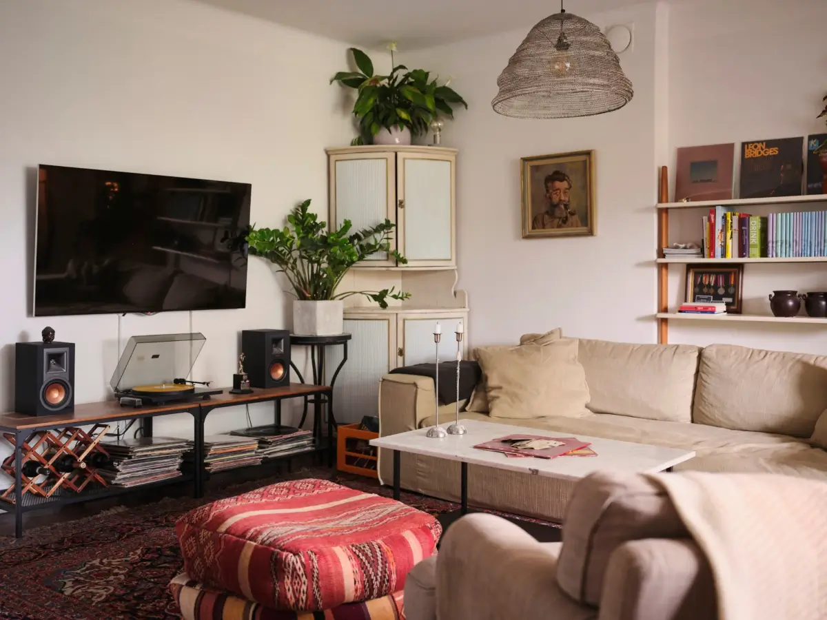 Exposed Beams and Dark-Stained Floorboards in a Cozy Attic Apartment 3 living room attic apartment