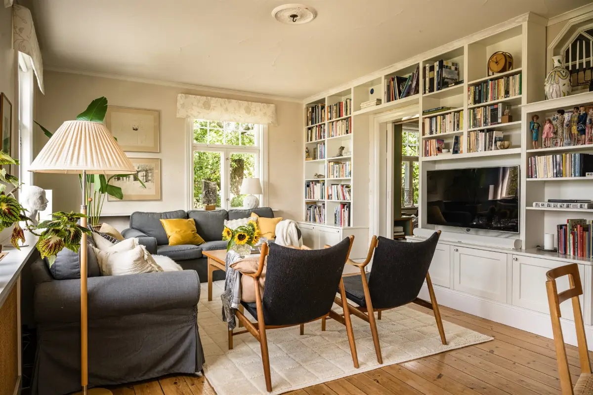 A Cozy Early 20th-Century Home with Views of Lake Mälaren in Sweden 12 living room built-in bookcase
