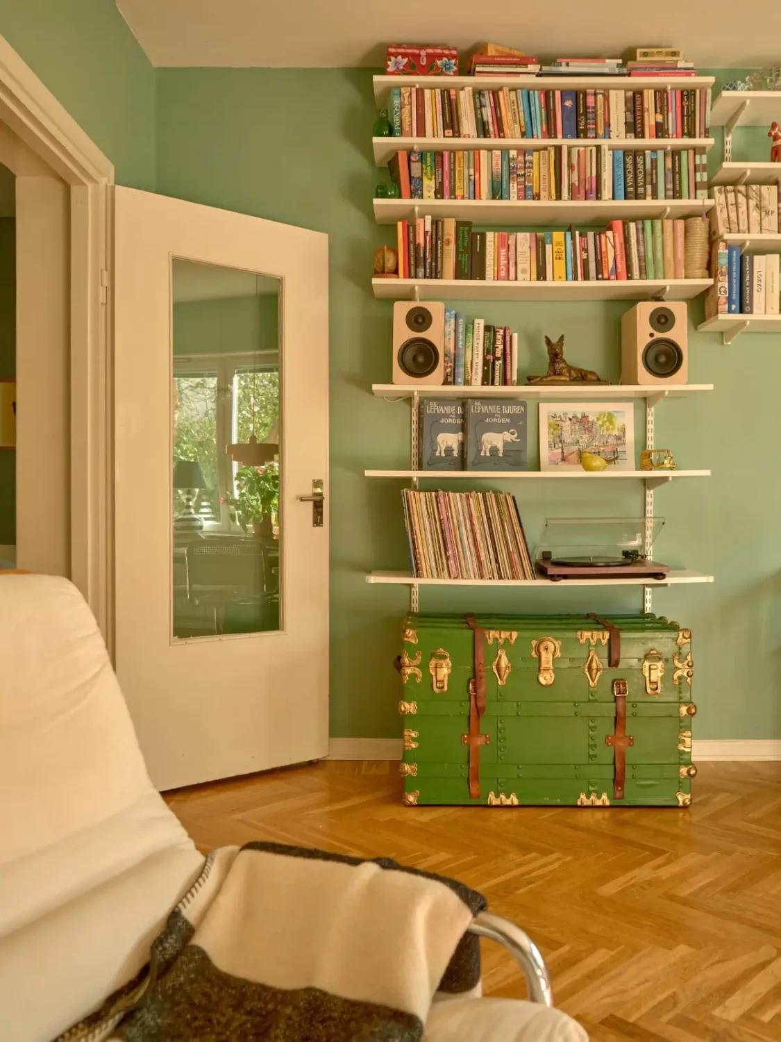 A Colorful and Cozy Midcentury Apartment in Stockholm 10 living room shelves
