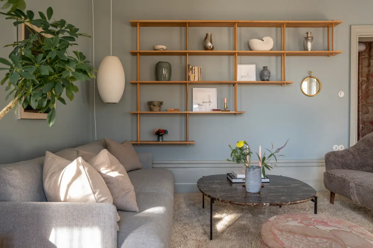 Historic Elegance and a French-Style Kitchen and Bathroom in a Stockholm Apartment 3 living room wooden shelving system