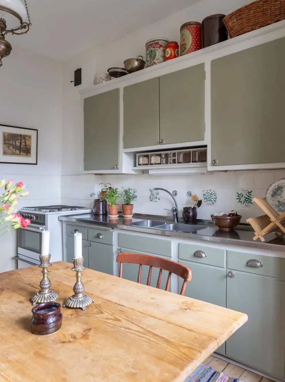 Warm Tones, Antiques, and Period Features in a Swedish Studio Apartment 15 midcentury kitchen