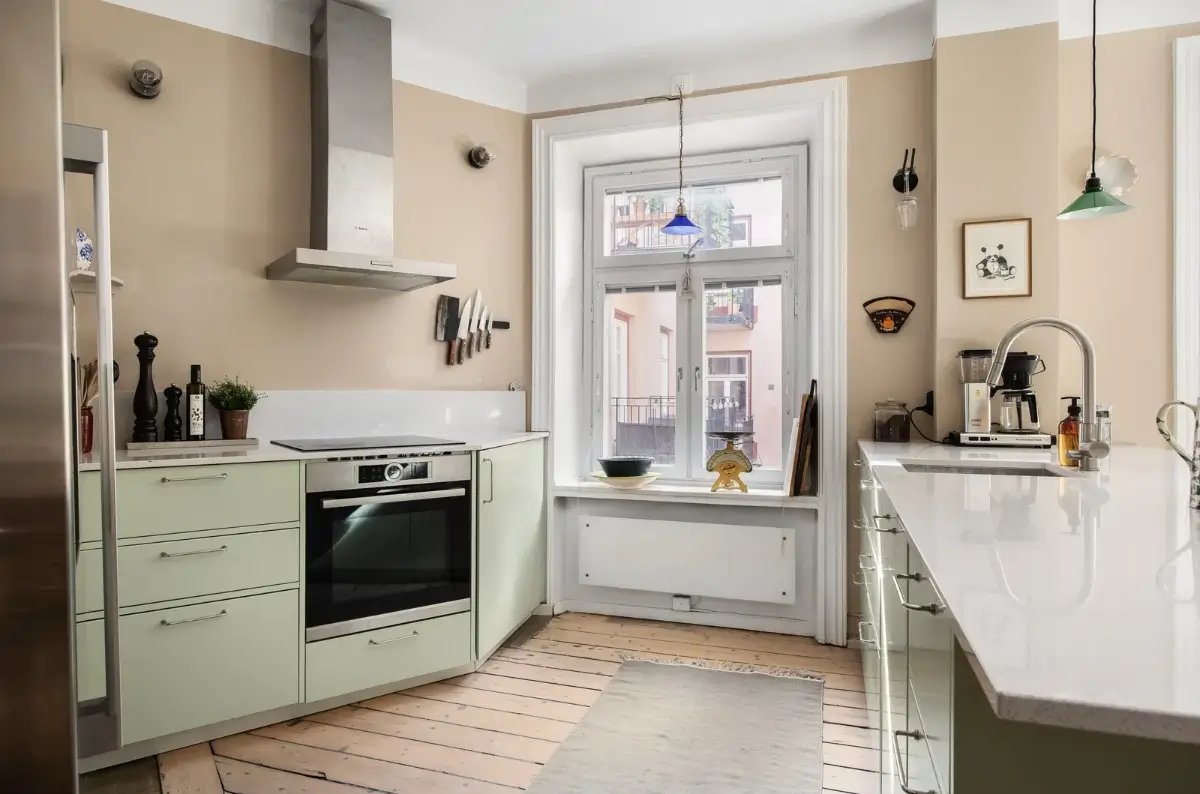 Warm Colors and an Open-Plan Living Space in a Stockholm Apartment 4 mint green kitchen beige walls