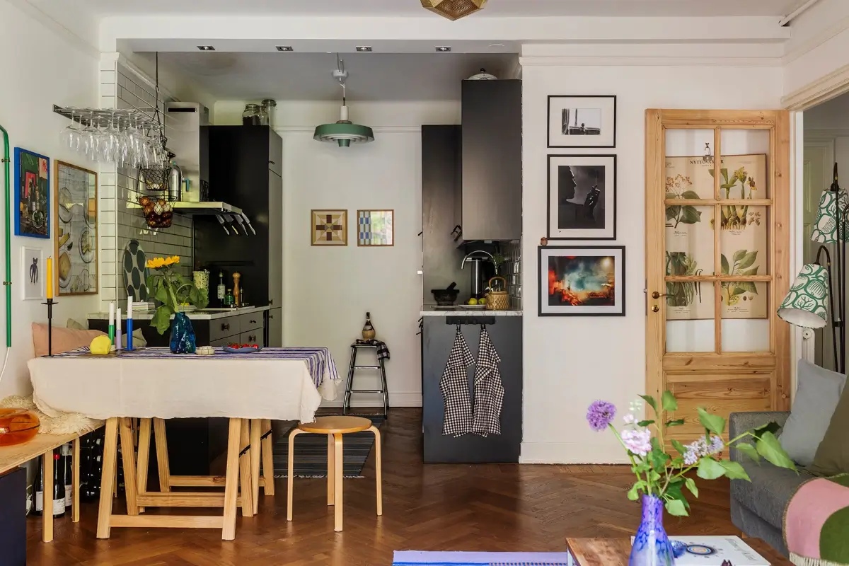 A Charming Swedish Courtyard Apartment Filled with Art 9 open plan living space herringbone floor