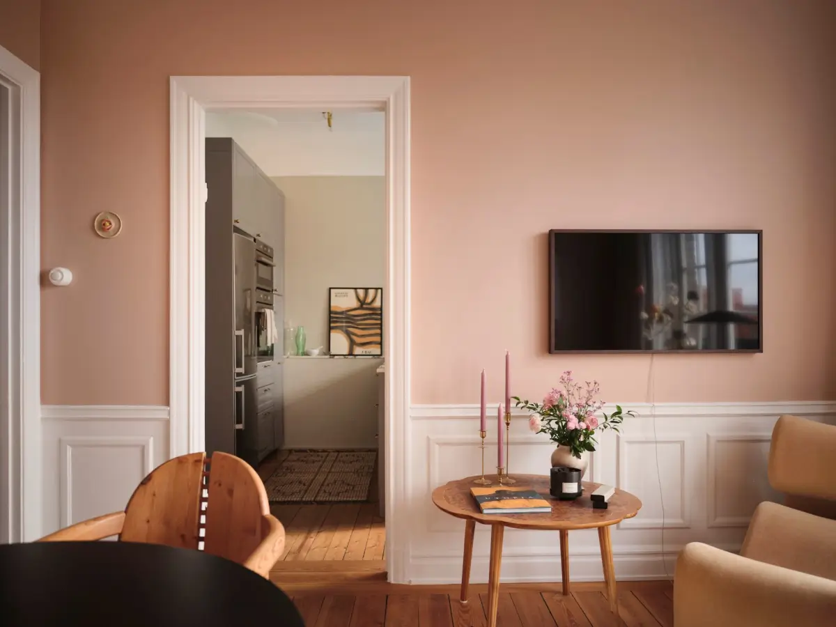 Warm Pink Walls and a Glass Room Divider in a Small Stockholm Apartment 16 pink living room warm wooden floorboards