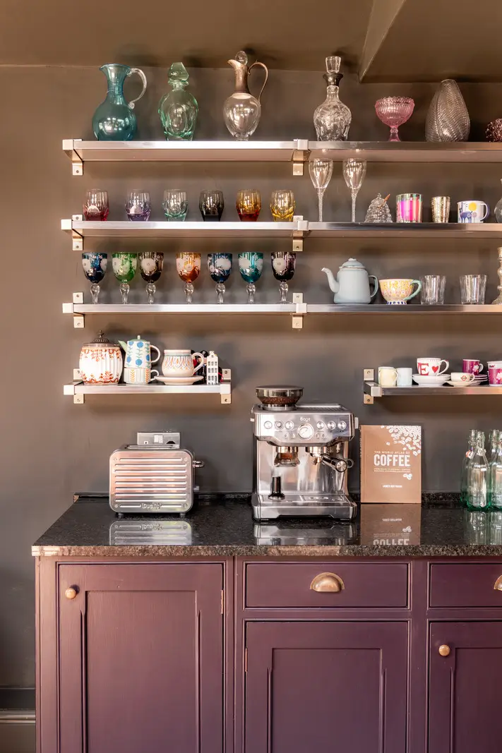 A Dramatic Color Palette in a Large Victorian Family Townhouse 9 purple cabinets shelves