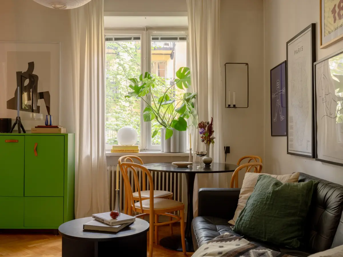 A 1920s Studio Apartment with a Forest Green Sleeping Alcove 6 round table by window