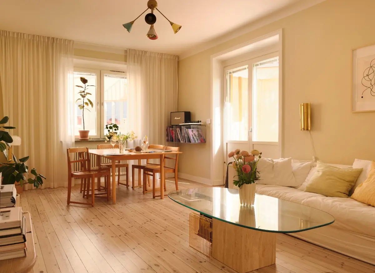 Soft Beige Interiors with the Occasional Bright Color Pop in Stockholm 1 scandi living room beige walls wooden floor