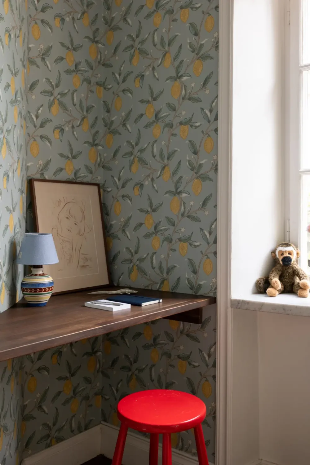 A Warm Color Palette in a Cozy 1920s Apartment in Stockholm 26 small built-in desk lemon wallpaper