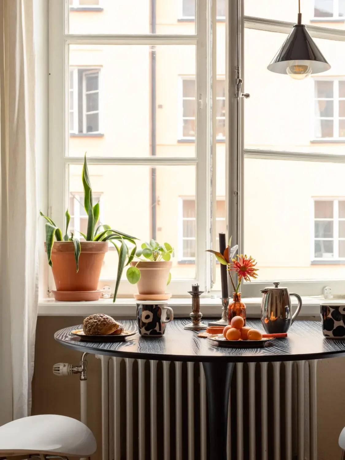 Warm Beige Walls and Practical Niches in a 1920s Studio Apartment 9 small dining table