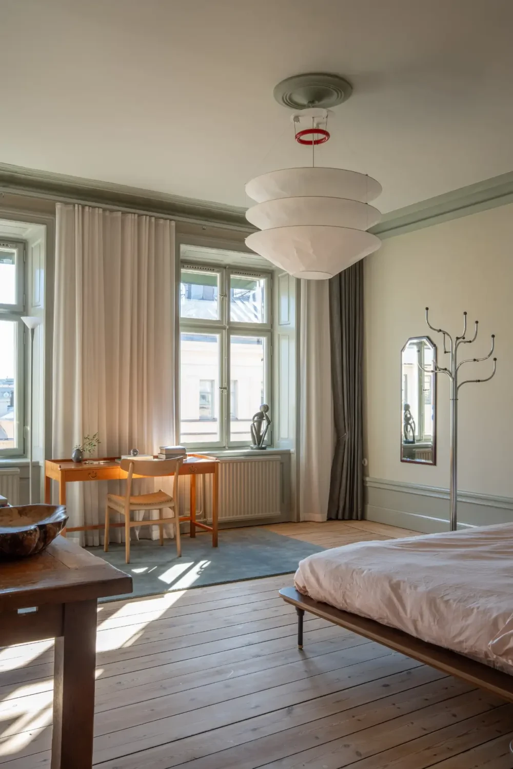 Historic Elegance and a French-Style Kitchen and Bathroom in a Stockholm Apartment 27 spacious bedroom large windows wooden floorboards nordroom