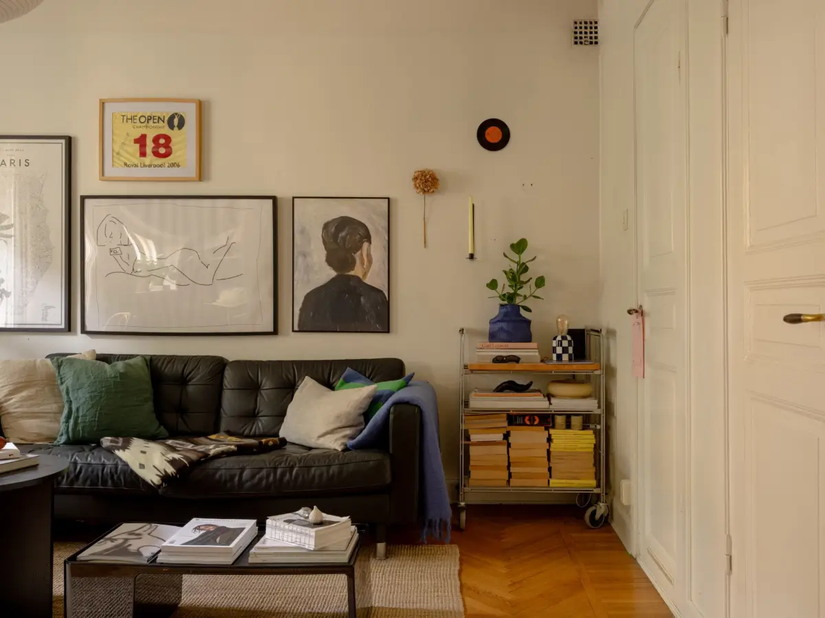 A 1920s Studio Apartment with a Forest Green Sleeping Alcove 7 studio apartment black sofa