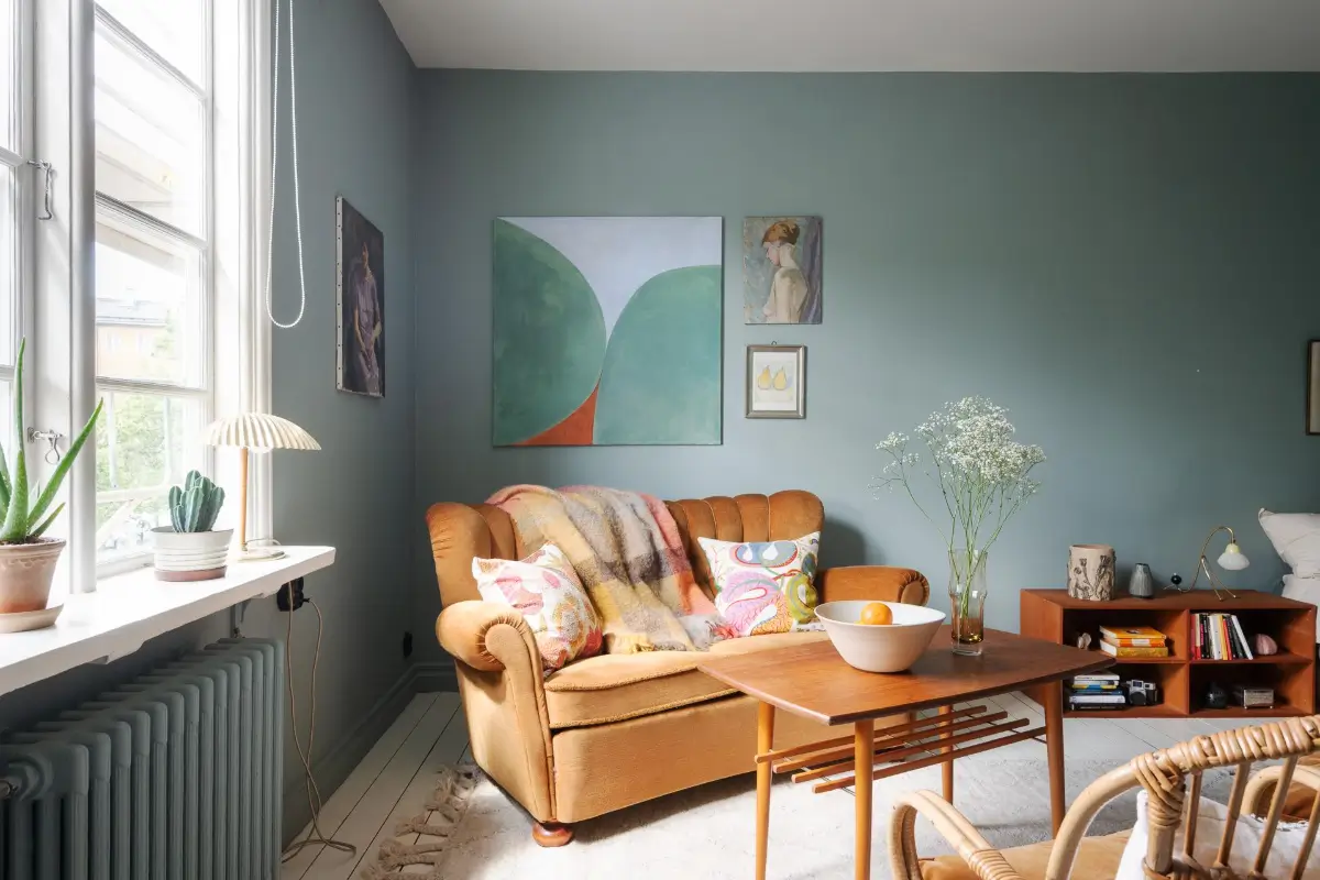 Historic Character and Color in a Swedish Studio Apartment 5 studio sitting area ochre sofa