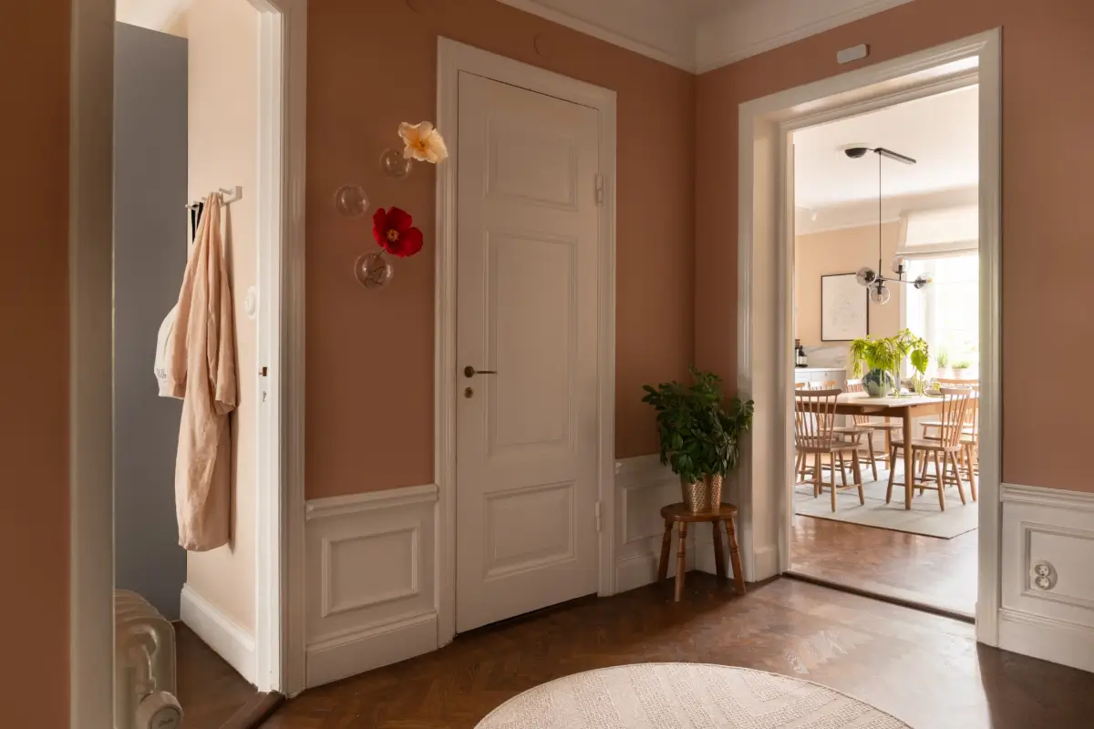 A Warm Color Palette in a Cozy 1920s Apartment in Stockholm 16 terracotta hall