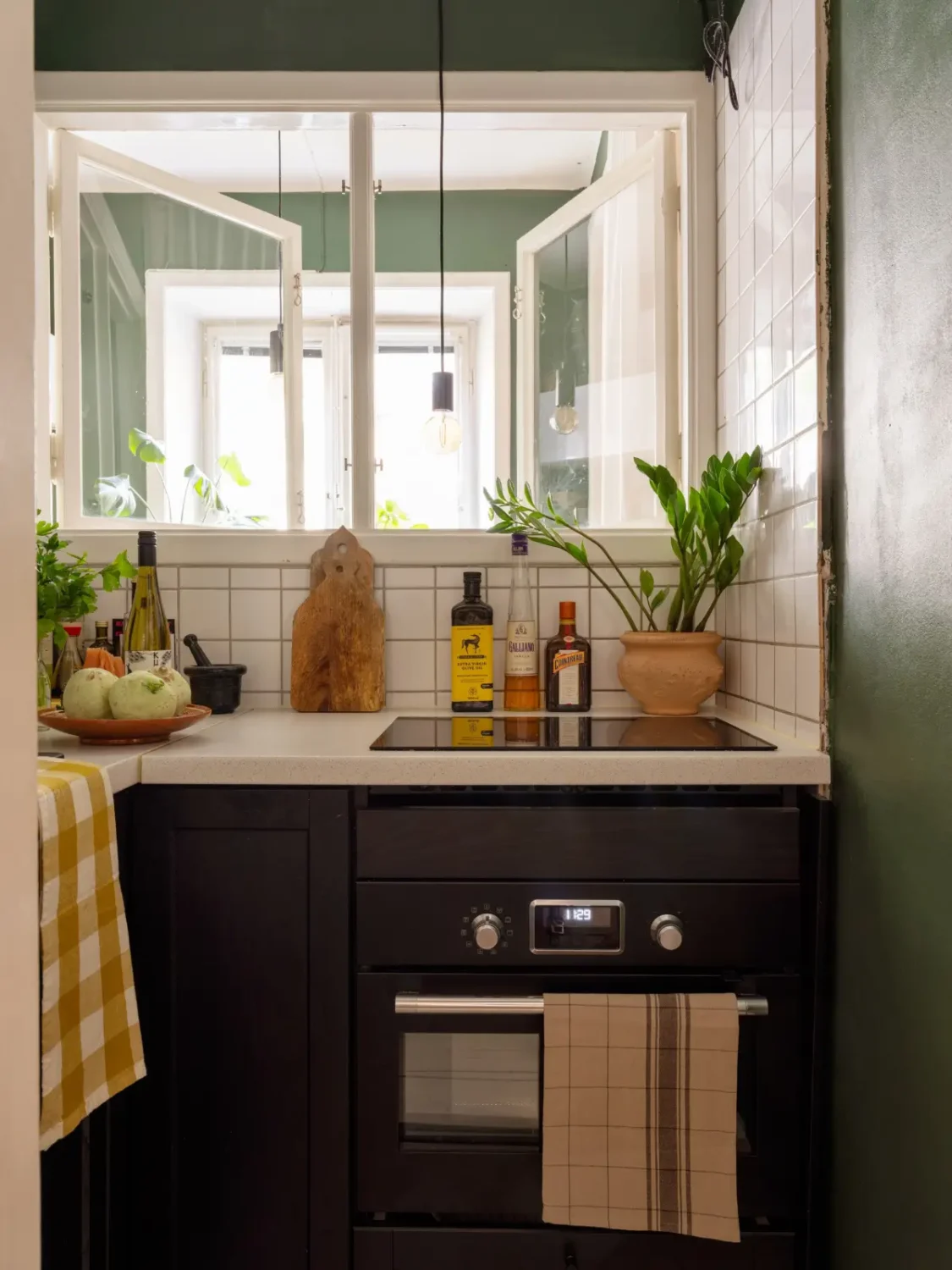 A 1920s Studio Apartment with a Forest Green Sleeping Alcove 15 tiny kitchen